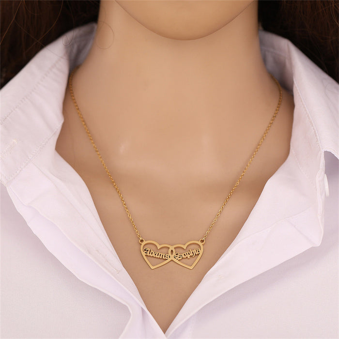 Customized two-name heart pendant necklace in titanium steel, available in gold, rose gold, and silver finishes for personalized couple jewelry.