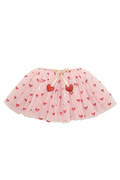 A light pink tulle tutu skirt decorated with small red bows and two red heart appliqués, tied with a beige ribbon at the waistband, shown on a plain white background.