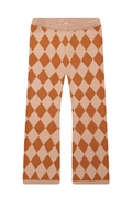Argyle patterned pants on a white background