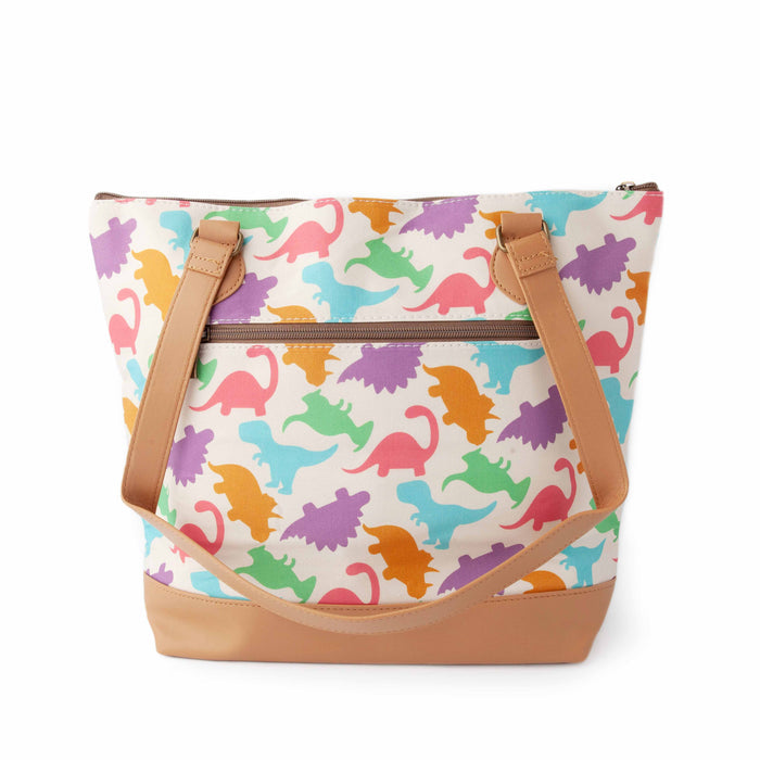 Dino Mega Trinity Bag back view showing the zippered exterior pocket with colorful dinosaur silhouette print on white canvas, tan vegan leather bottom, and shoulder strap draped across