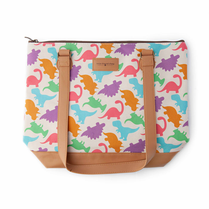 Dino Mega Trinity Bag front view with handles up and shoulder straps down showing the colorful dinosaur silhouette print with Twice Sheared Sheep label and tan vegan leather bottom