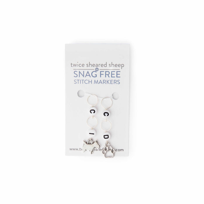 Dog and pawprint crochet counter stitch markers on Twice Sheared Sheep Snag Free packaging card