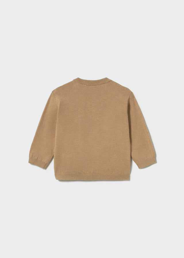 Beige sweater on a white background