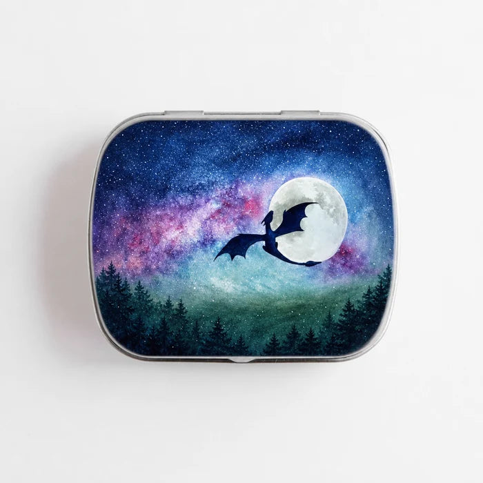 Small hinge-style Dragon Moon storage tin front view showing watercolor dragon silhouette flying past full moon against galaxy night sky with purple nebula and forest treeline