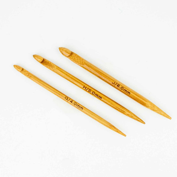 Three Duo wooden repair hooks showing the pointed end with size markings including G/4.0mm, H/5.0mm, and J/6.0mm
