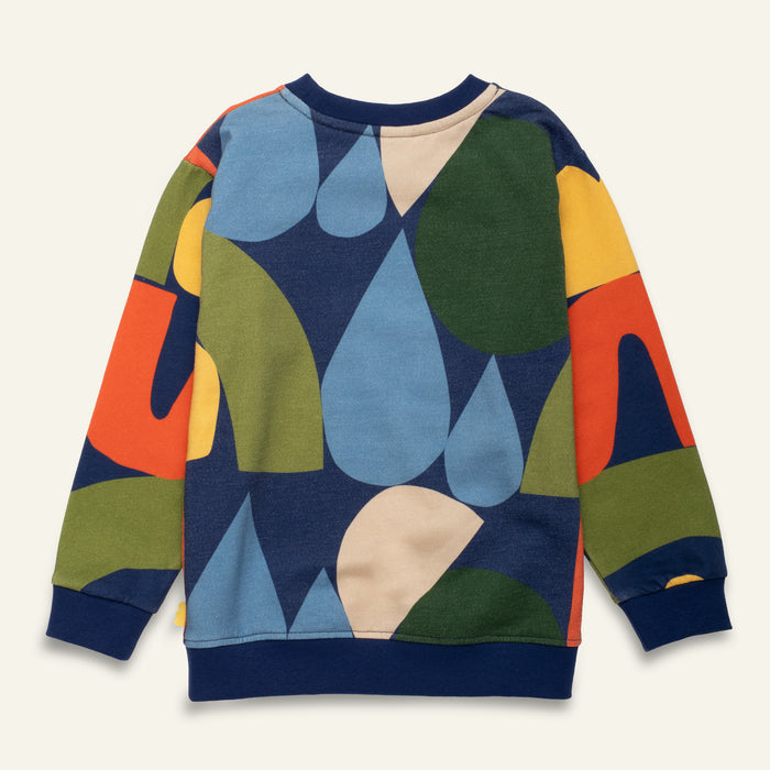 Colorful sweater with abstract pattern on a light gray background