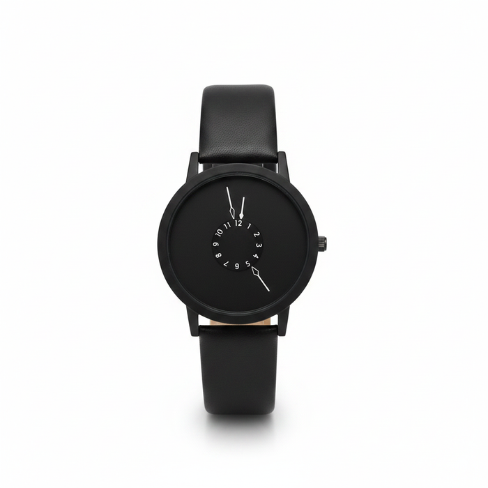 A sleek, all-black minimalist watch featuring a unique central numerical dial and a smooth matte finish, paired with a premium black leather strap for a sophisticated "Art Gallery" editorial aesthetic.
