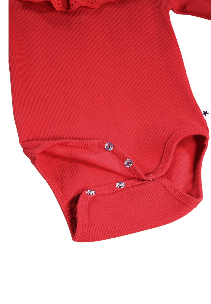 Red baby onesie with buttons on a white background