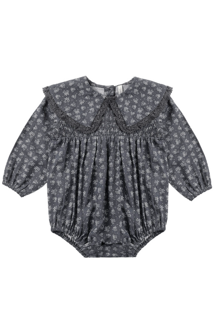 Baby romper with heart pattern on a white background