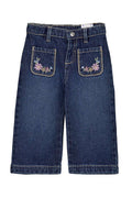 Blue jeans with floral embroidery on pockets on a white background