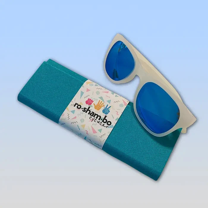 Blue sunglasses with a green case and colorful label on a light blue background