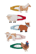 Five fabric hair clips shaped like farm animals, including a horse, sheep, cow, chicken, and bull, arranged vertically on a plain white background.