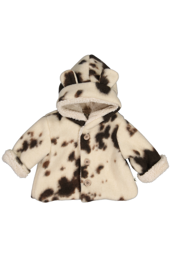 Children's fur coat with a spotted pattern on a white background
