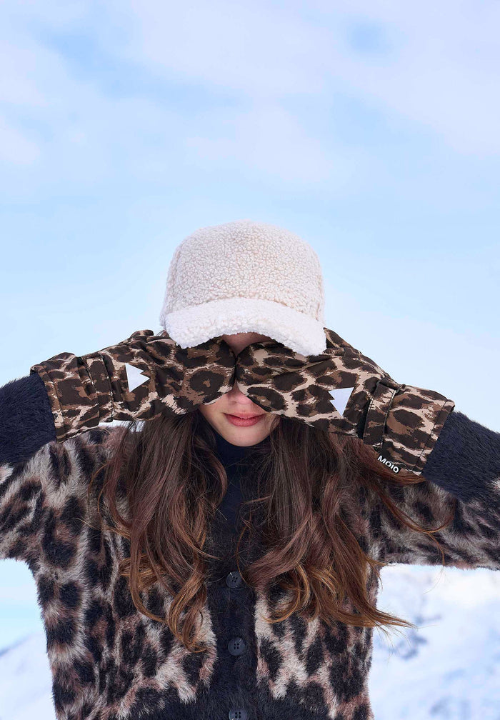 Person wearing a leopard print cardigan