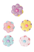 colorful flower-shaped hair accessories on a white background