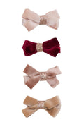 Set of four decorative bows with glitter accents on a white background