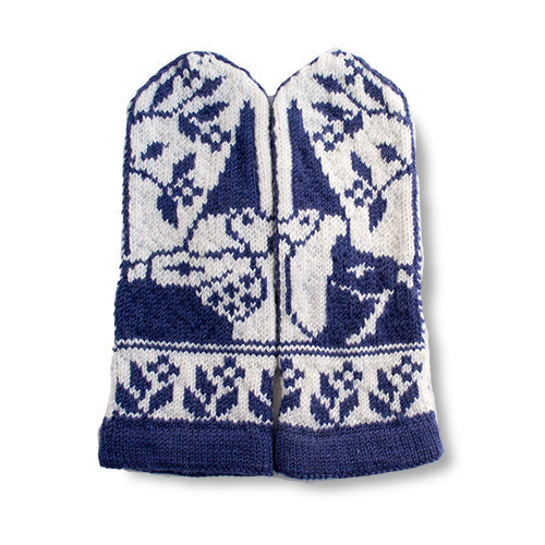 Pair of Gnomes in Love mittens laid flat showing the front with navy and white stranded colorwork gnome and snowflake motifs