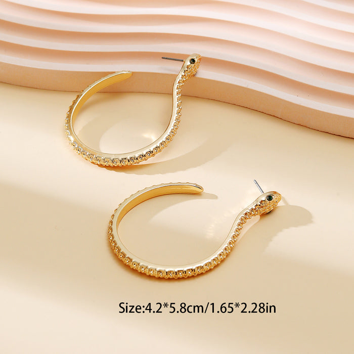 Gold Snake Hoop Earrings with Green Crystal Eyes | Pavé Serpent Jewelry