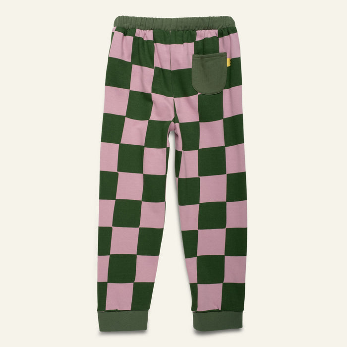 Checkered pants with green and pink squares on a white background