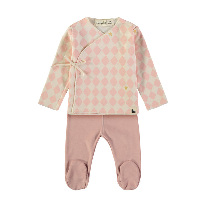Baby two-piece outfit set featuring a long-sleeve wrap jacket with a cream and light pink argyle pattern and small yellow star details, paired with matching light pink footed pants.