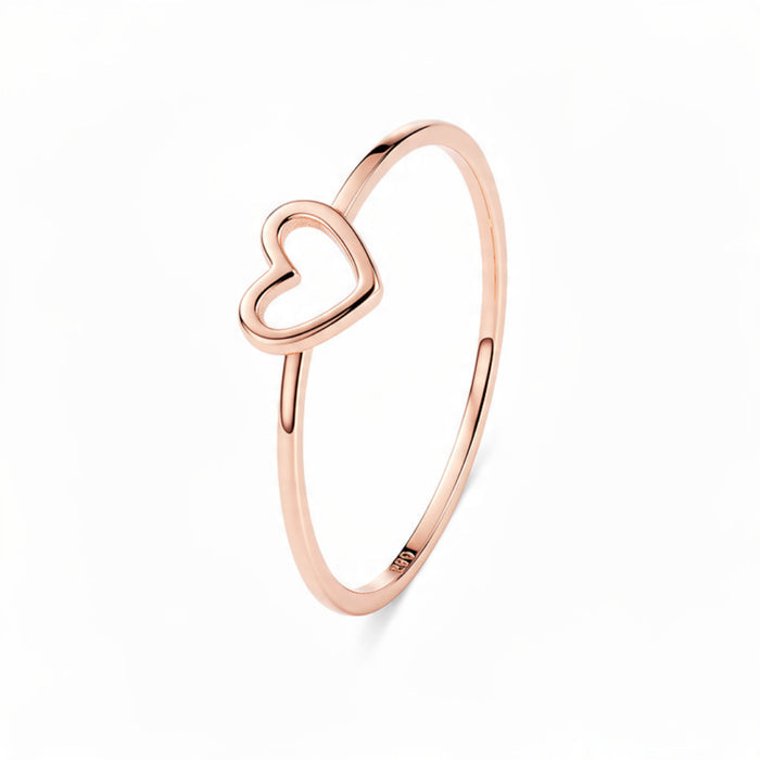 Minimalist rose gold open heart ring on pure white background, delicate thin band with heart outline design, dainty love jewelry for women