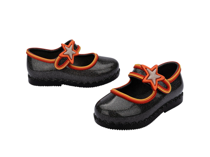 Black shoes with orange and gray star designs on a white background