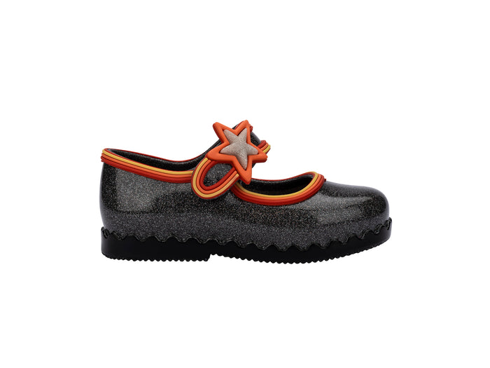 Black shoe with a star design on a white background