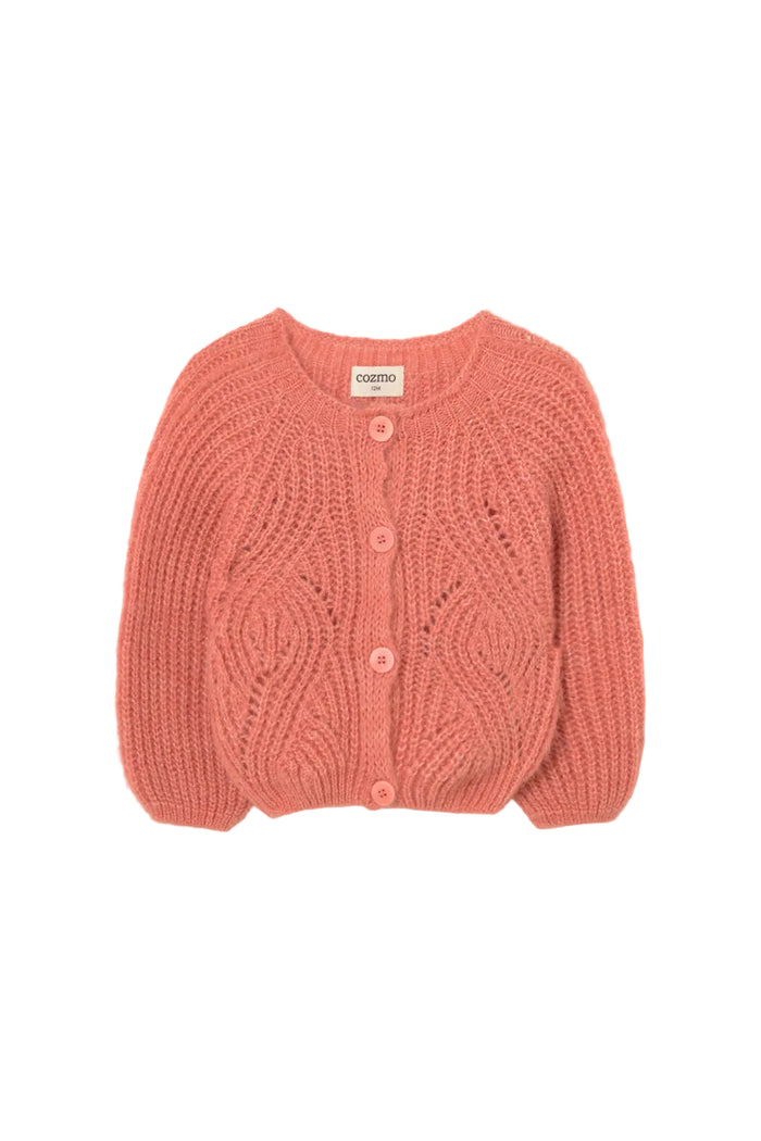 Pink knitted cardigan on a white gray background