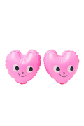 Two pink peach-shaped arm bands with faces on a white background