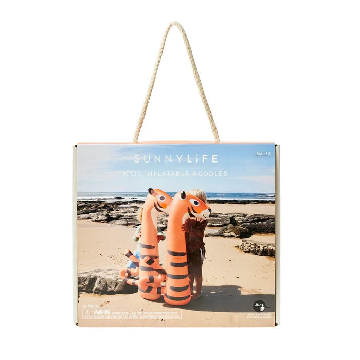 Sunnylife inflatable noodles packaging on a beach