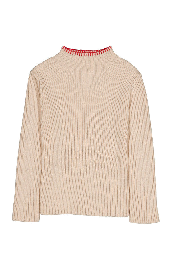 A ribbed knit long-sleeve mock neck sweater in a light beige or cream color, featuring a distinctive red and white patterned trim along the collar, shown against a plain white background.