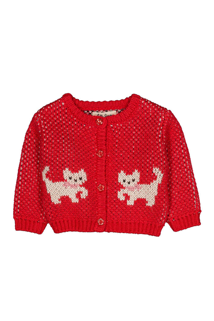 A red knit cardigan sweater with two white cat motifs on the front, featuring a button-up closure and long sleeves, shown against a plain white background.