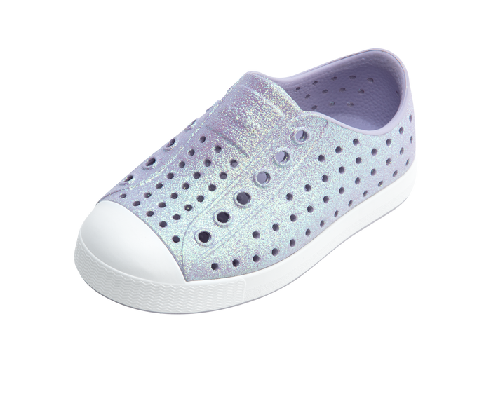 Purple glittery shoe with white sole on a white background