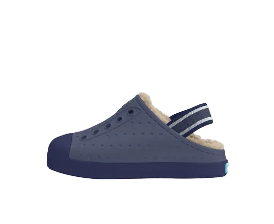 Navy blue clog shoe with fur lining on a white background