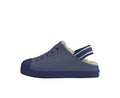 Navy blue clog shoe with fur lining on a white background