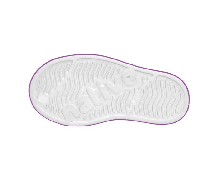 White sole of a shoe with purple rim on a white background