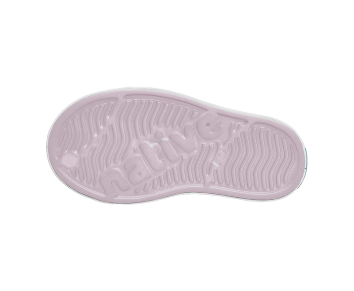 Pink sole of a shoe with brand logo on a white background