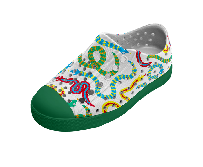 Colorful snake-patterned shoe with green sole on a white background