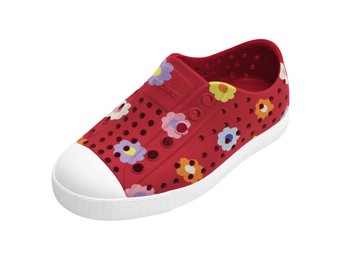 Red children's shoe with floral patterns on a white background