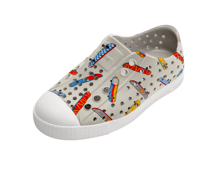 Children's shoe with colorful patterns on a white background