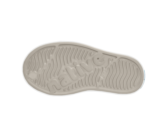 Sole of a shoe with a brand logo on a white background