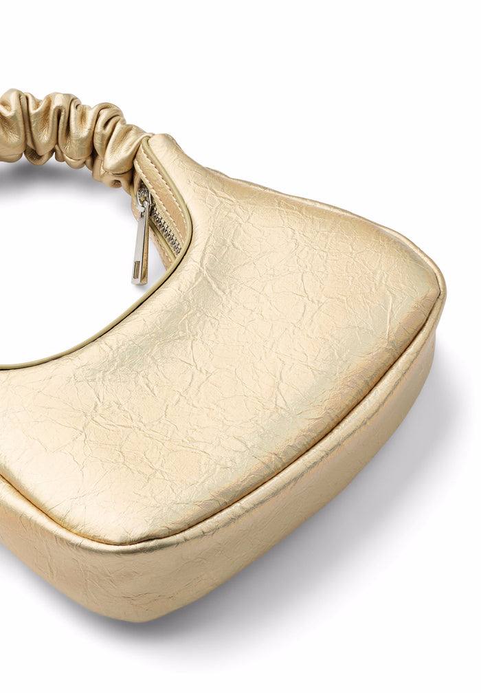 Gold handbag with textured surface on a white background