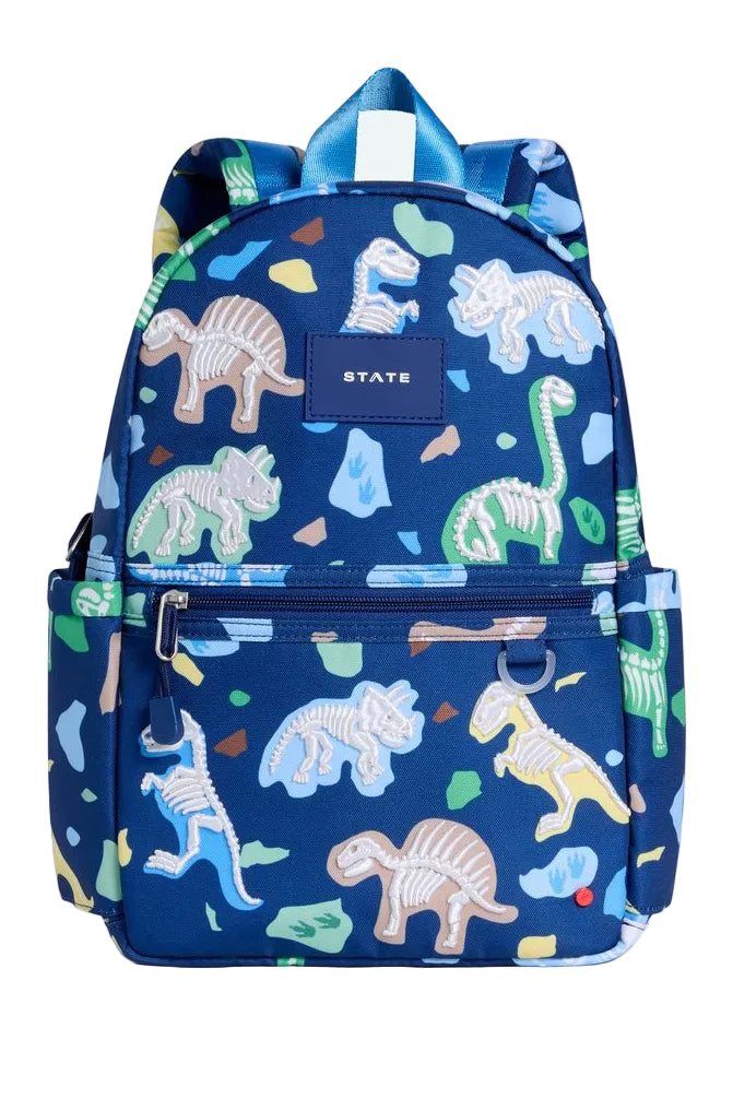 Navy blue backpack with dinosaur pattern on a white background