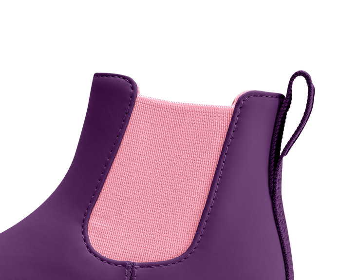 Close-up of a purple boot with pink interior on a white background