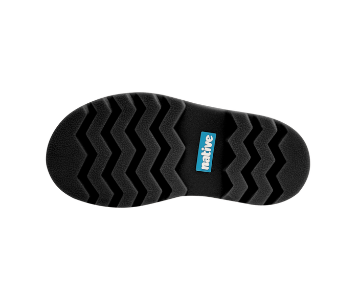 Black sole of a shoe with a visible brand logo on a white background