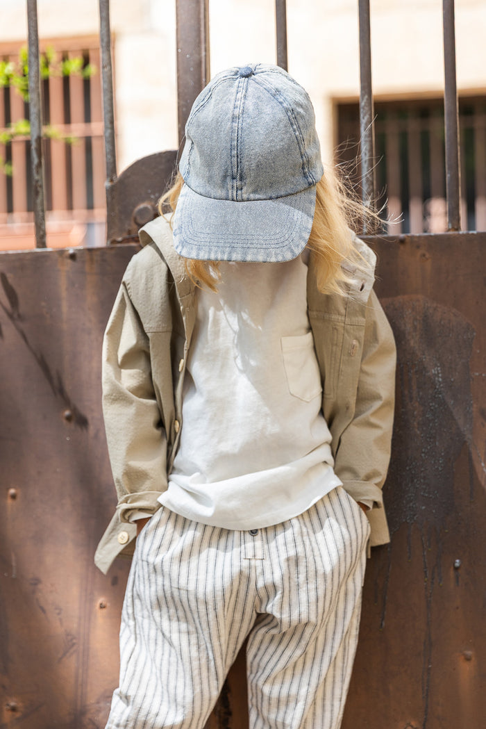 child wearing khaki hooded jacket