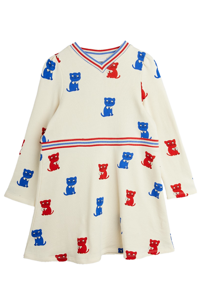 White dress with blue and red kitten pattern on a white background