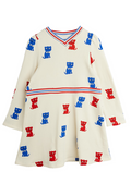 White dress with blue and red kitten pattern on a white background