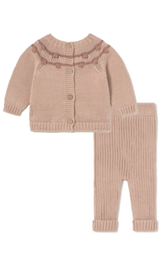 Knitted baby set with sweater and pants on a white background
