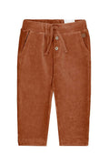 Brown corduroy pants with a drawstring on a white background